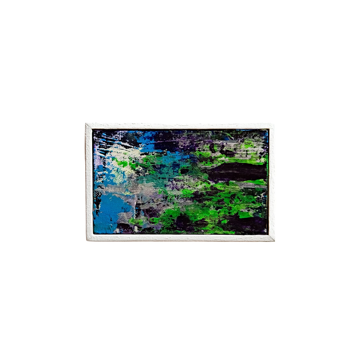 Abstract painting with blue and green tones on a white wall