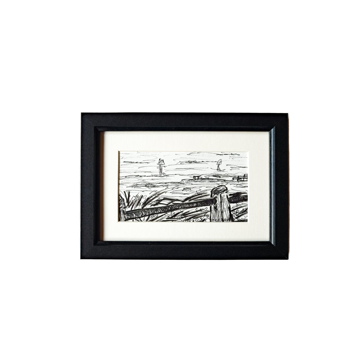 This image features a framed artwork titled "From the Boating Lake," created using acrylic ink and a fineliner. The artwork depicts a serene scene of a lake with boats and trees in the background, rendered in a minimalist style with a predominantly black and white color palette.