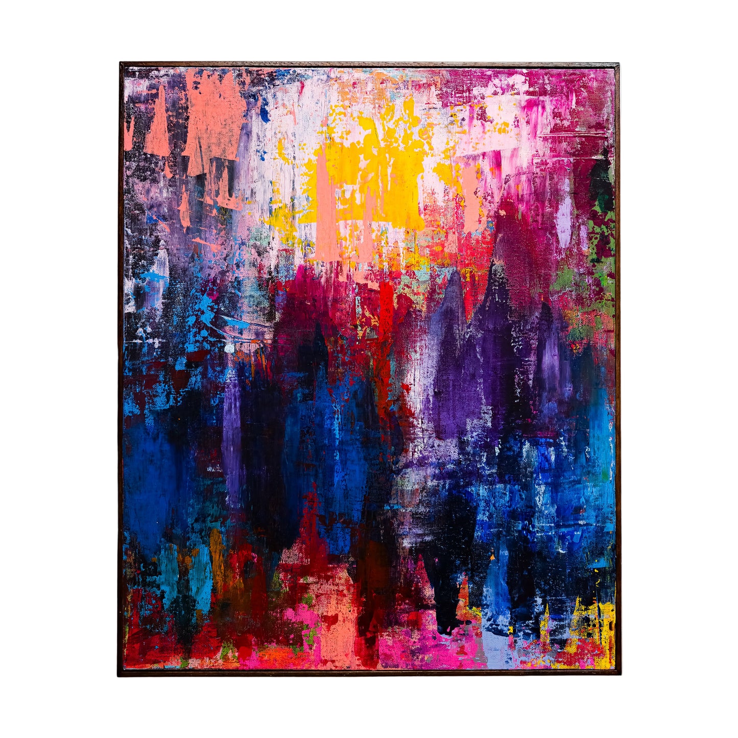 Abstract painting with vibrant colors on a white wall