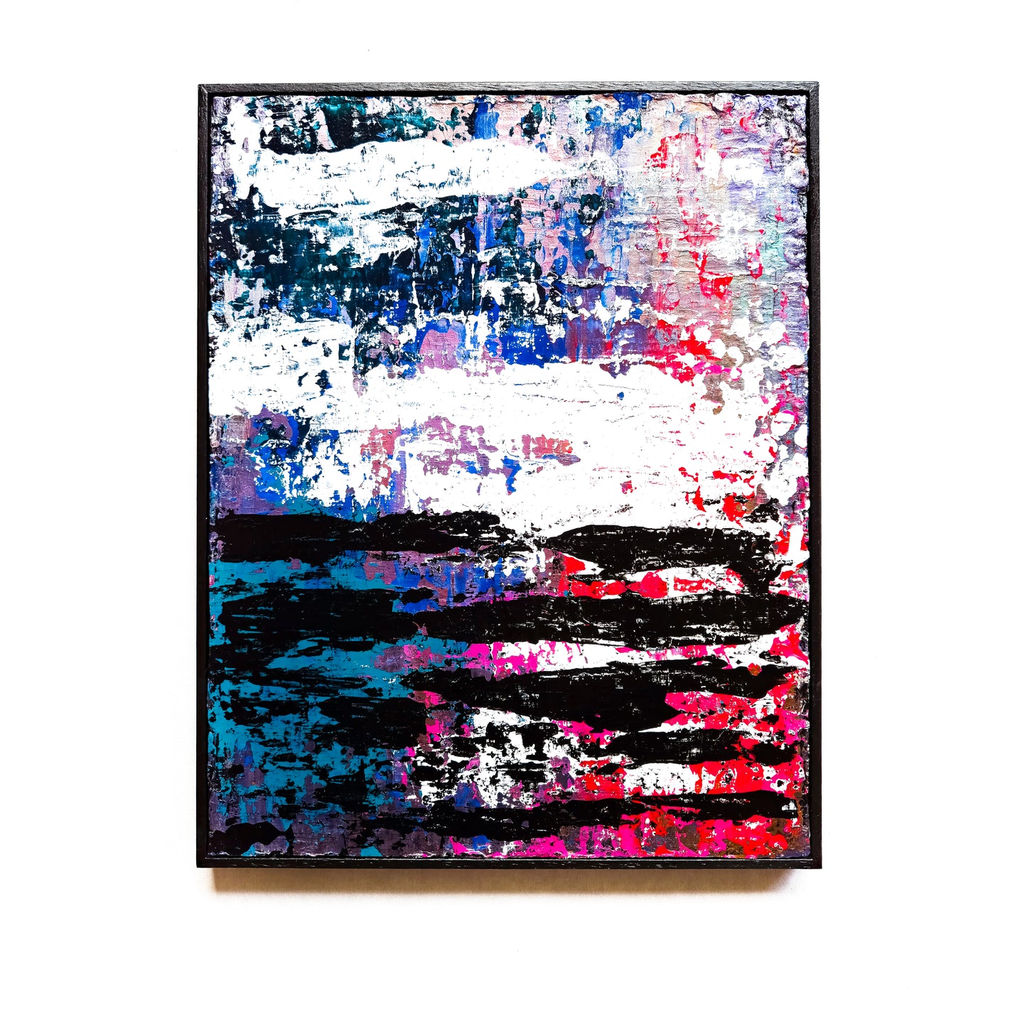 Abstract painting with splashes of blue, pink, and black on a white background