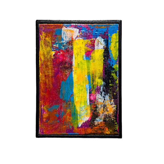 Abstract painting with vibrant colors on a white wall