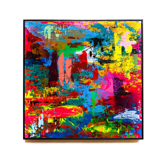 Abstract painting with vibrant colours on the white wall. 