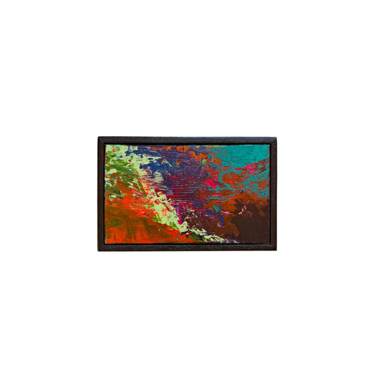 Colorful abstract painting in a black frame on a white background