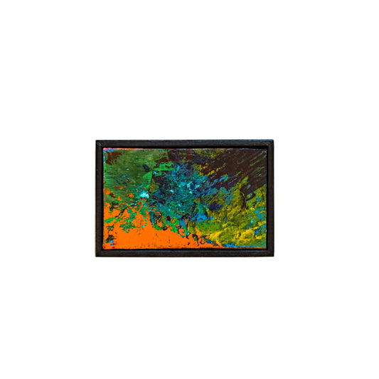 Abstract painting with orange, green, and blue colors in a black frame on a white background