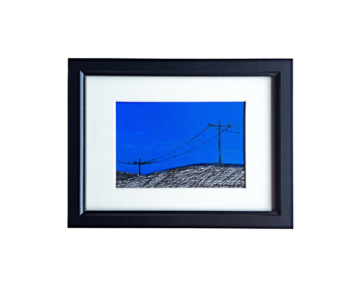 Framed ink sketch of pylons on the hill. 