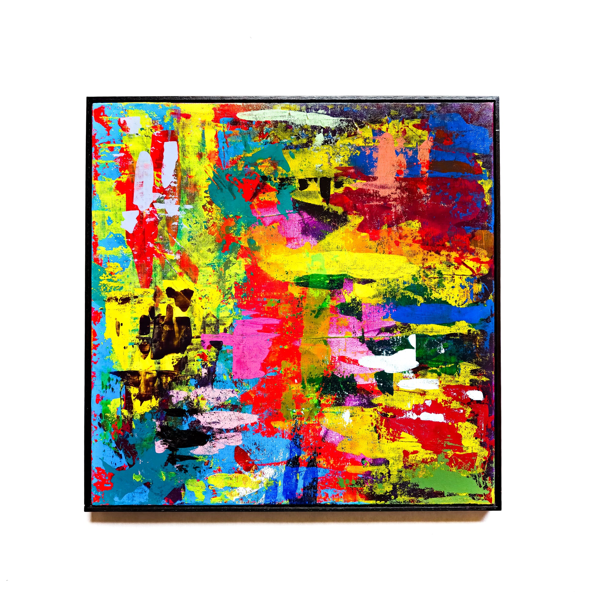 Abstract painting with vivid colours on a white wall. 